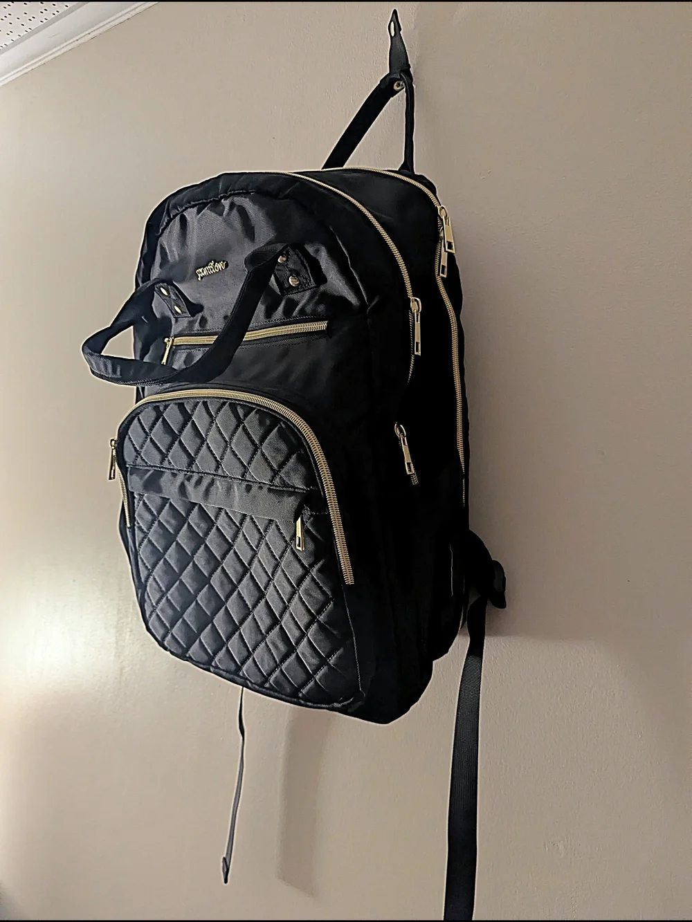 Black Quilted Backpack with Gold Accents
